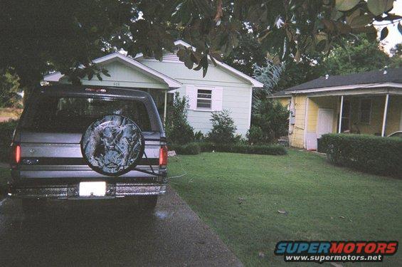 Rear view of a 1995 Ford Bronco with a camouflage spare tire cover