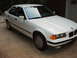 1993 BMW 3 Series - A white 1993 BMW 3 Series sedan is parked outdoors.