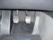 1993 BMW 3 Series - The interior footwell of a 1993 BMW 3 Series, the clutch, brake, and accelerator pedals.