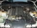 1993 BMW 3 Series - The engine bay of a 1993 BMW 3 Series, viewed from above, reveals the inline-six engine and associated parts.