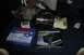 1989 Ford Crown Victoria LTD - Several automotive transmission parts are laid out on a dark carpeted floor.