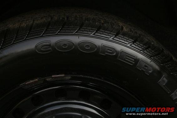 Cooper tire on a black steel wheel