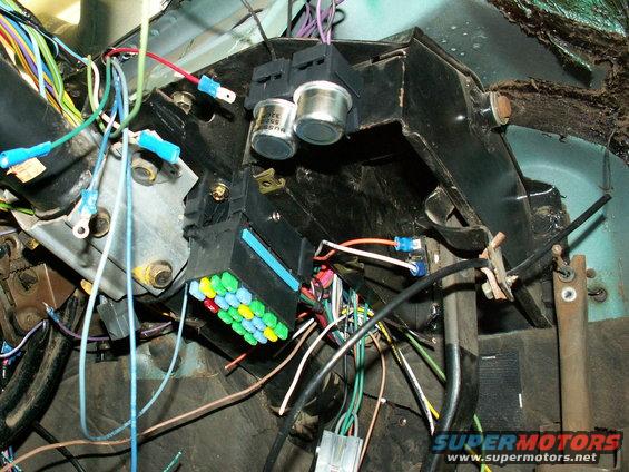 The 'Its A Snap' fuse block mounted on flat metal beside steering column....srcrewed thru the base of fuse block....21 circuits (3 more than Painless) will cover everything  ....now and for future.