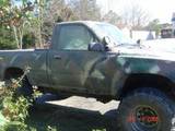 Camouflaged pickup truck, 3q-front view