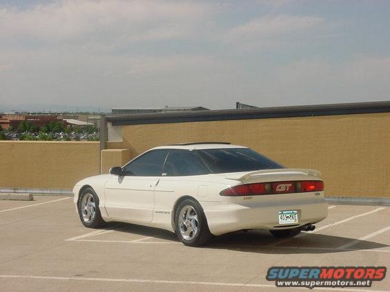 White 1996 Ford Probe GT parked in a lot, rear 3/4 view