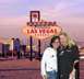 1993 Ford Taurus - Two women pose for a photo in front of the famous Las Vegas sign with city buildings in the background.