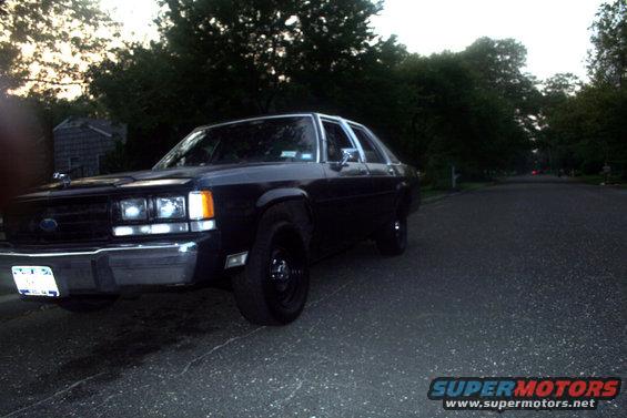 1989 Ford Crown Victoria LTD parked on a street, front 3/4 view
