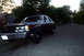 1989 Ford Crown Victoria LTD - Dark 1989 Ford Crown Victoria LTD parked on a tree-lined residential street.