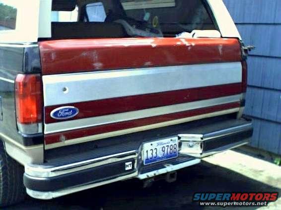 Red and silver Ford Bronco rear with a license plate reading 133 9788