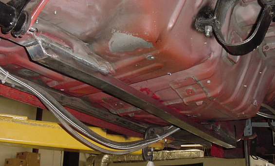 1993 Ford Mustang underbody showing frame reinforcement and brake lines
