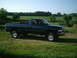 2001 Dodge 2500 - This dark blue 2001 Dodge 2500 pickup truck is seen from the side in a rural setting.