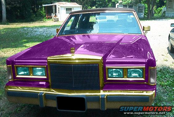 Purple and gold customized sedan, front view. Likely a Lincoln Town Car or similar from the mid-1980s