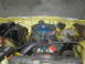1977 Jeep Wagoneer - The engine bay of a vehicle, showing various mechanical components and wiring under the hood.
