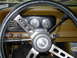 1977 Jeep Wagoneer - Interior view of a 1977 Jeep Wagoneer dashboard, showing the steering wheel, gauges, and gear selector.
