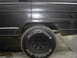 1977 Jeep Wagoneer - Close-up of the rear wheel well on a 1977 Jeep Wagoneer, showing some rust.