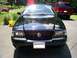 2003 Mercury Marauder - Front view of a black 2003 Mercury Marauder parked outside, with a red SUV in the background.