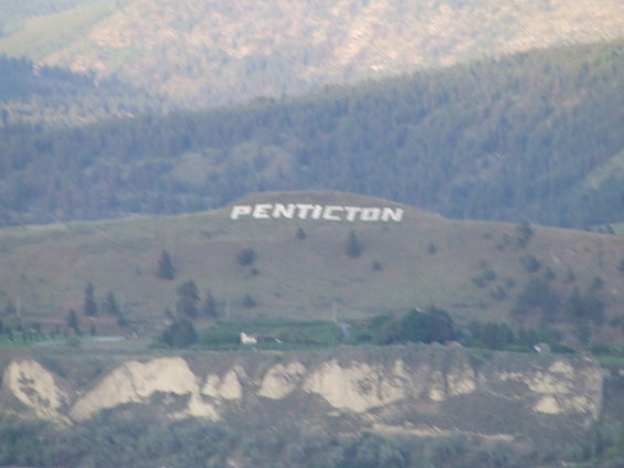Hillside with PENTICTON spelled out in large white letters