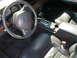 2002 Ford Crown Victoria - Interior view of a 2002 Ford Crown Victoria, highlighting the dashboard and seating.