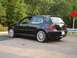 2003 Volkswagen GTI - Black 2003 Volkswagen GTI parked on a roadside with trees in the background.
