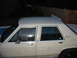 1985 Ford Crown Victoria LTD - This 1985 Ford Crown Victoria LTD sedan is seen from the side, showing its tan exterior.