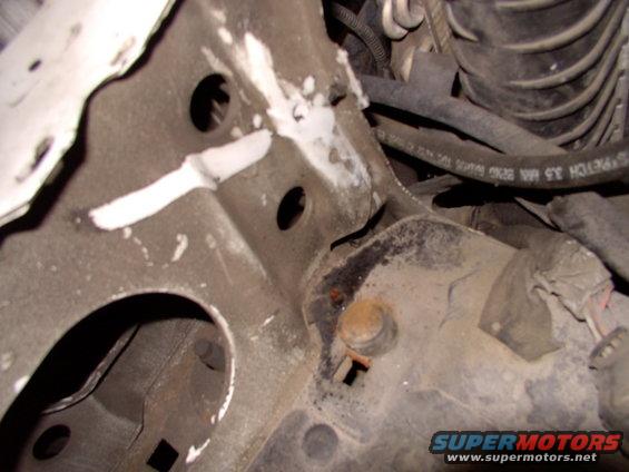 Everything below the white (clean) line on a slant is where the available airbox will accept the fresh air tube later. Note the already rusted and busted front airbox mount. The rubber isolator always pulls loose of the mount anyway.