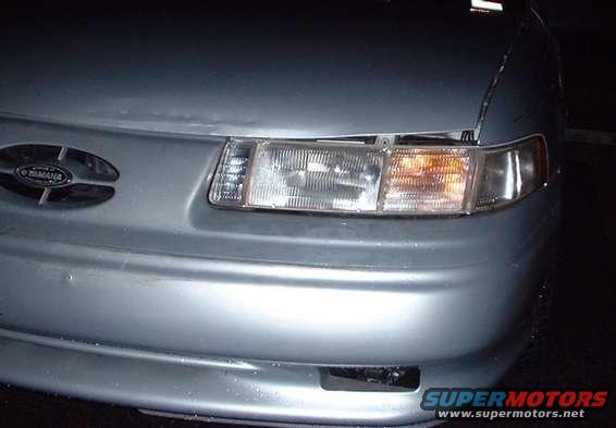 newlight.jpg new headlight housing and turn signal. old hood.