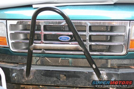 Green Ford Bronco grille with a chrome brush guard and a Ford logo