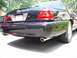 2003 Mercury Marauder - Rear view of a black 2003 Mercury Marauder sedan, showing its distinctive taillights and dual exhaust pipes.