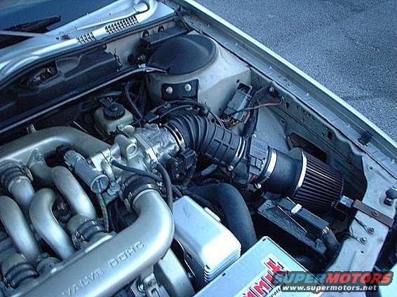 engine.jpg Shot of dirty engine, 73mm Mass air meter, K&N conical filter, and strut bar.