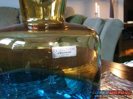 Waterford decanter with blue and amber glass, label says 'EVOLUTION by WATERFORD Made in Poland'