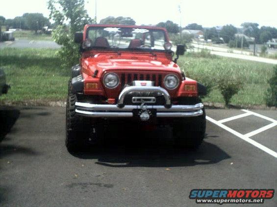 Red Jeep Wrangler front view with winch and aftermarket bumper