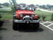 1996 Ford Bronco - This red Jeep Wrangler is shown from the front, a winch and custom bumper.