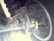 1996 Ford Bronco - Detail of the front suspension and brake components of a vehicle, with visible text from Supermotors.net.