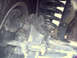 1996 Ford Bronco - Detail shot of the front suspension system and tire, with a Supermotors watermark visible at the bottom right.