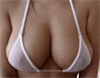 Close-up of a woman's chest wearing a white bikini top