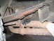 1982 Chevrolet Blazer - The underside of a vehicle shows a section of the exhaust system and suspension components.