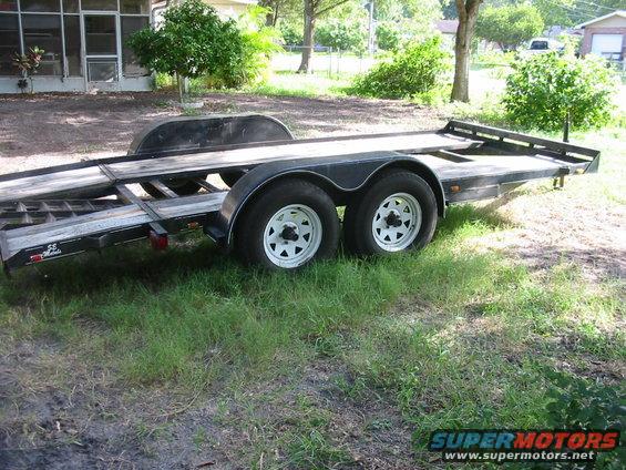 car hauler trailer with dual axles and ramps