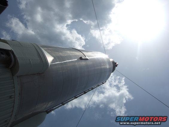 Rocket against a cloudy sky, viewed from below