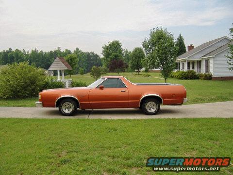 Orange 1979 Ford Ranchero parked on a concrete driveway, side view