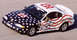 1995 Ford Mustang - A 1995 Ford Mustang race car, adorned with stars and stripes, speeds around a track.