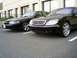 2003 Mercury Marauder - Two black sedans, a Mercury Marauder and a Mercedes-Benz S-Class, are parked side-by-side in a lot.