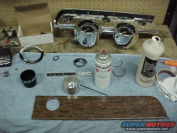 2005inst3.jpg The rechromed and detailed instrument bezel looks great. I painted the back ground areas on the dash emblems. The wood grain dash parts are the original ones and were carefully stained and then waxed to make them appear new again.