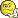Yellow smiley face icon with a hand gesture