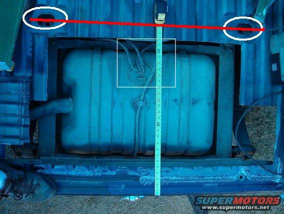 Fuel tank with tape measure and red line indicating measurement points
