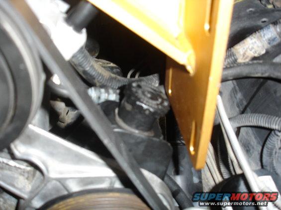 bronco-003.jpg There's about a 1/4" clearance between the cap and bracket. Just enough to get the cap off.