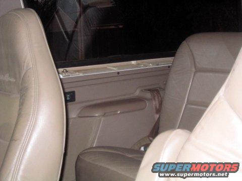 Tan leather seats and door panel inside a 1996 Ford Bronco