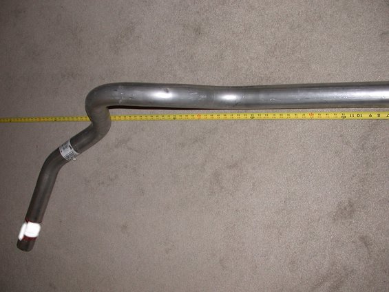 Exhaust pipe section with white tape on end and label