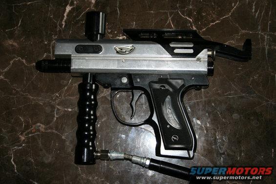 Paintball gun with black foregrip and silver body