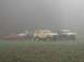 1978 Ford Bronco - A 1978 Ford Bronco is parked with three other SUVs in a foggy field.