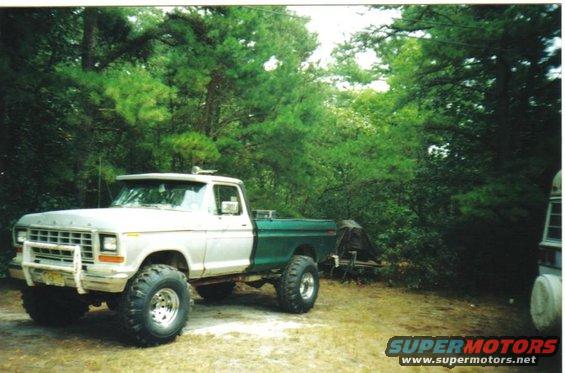 Silver and green lifted 1979 Ford F-250 pickup truck, 3q-front view